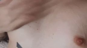 Fairy skin tattooed girl covering her big boobs in saliva