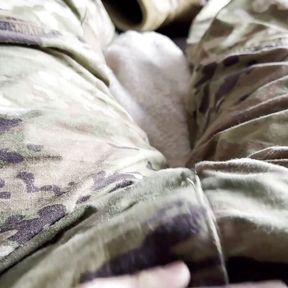 Army soldier strips off boots and reveals a swimsuit under his uniform and jerks off his throbbing cock