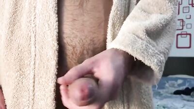 Perverted gay bloke is stroking his prick right after the shower