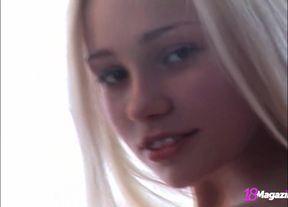 Long-haired hottie Holli Paige gets naked on the couch!