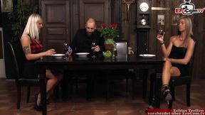 Two slim lesbians having strap-on dildo sex in a restaurant