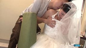 The new asian wife is still dressed in her wedding gown when someone visited her