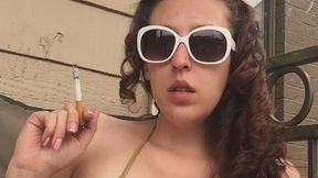 Sexy Goddess D in Gold Bikini Top Smoking Marlboro Red 100 - Vertical Video