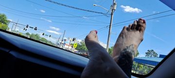 Bare Feet on Dashboard in Moving Car