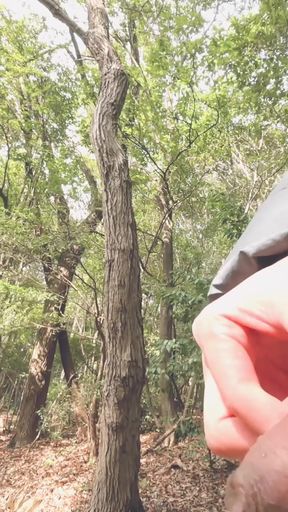 A boy with a small foreskin pees a huge stream outdoors   Clip 1