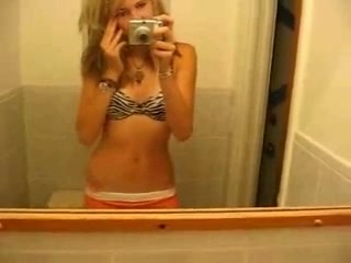 Slender pretty blonde girl flashed her small tits while stripping on webcam