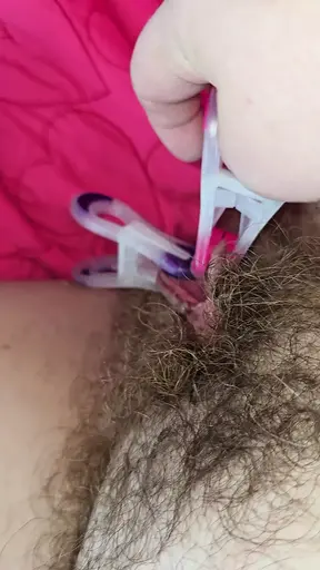 Whore Puts Clamps On Her Labia And Clit