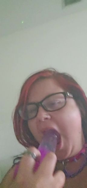 Sucking on a Big Purple Dildo