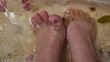 Washing my feet with rose petals and herbs after a HARD day of work