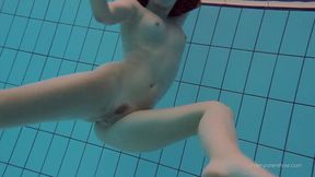 Tight-hairy Katy Soroka in a white outfit under water