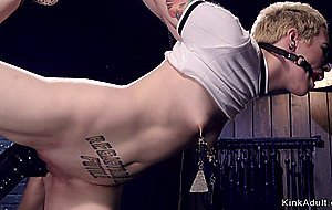 Short hair blonde in device bondage