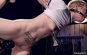 Short hair blonde in device bondage
