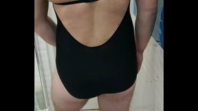 Boy wearing one piece adidas swimsuit