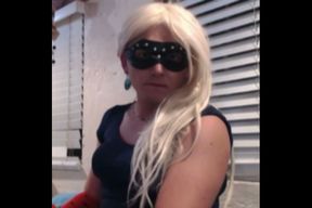 Faggot dressed as a whore sucking a dildo