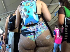 Curvy babe in fishnet lingerie exposes her big round booty