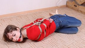 Ballgagged barefoot Agnes in red sweater and jeans, hogtied with hemp rope, rolls and wiggles on the floor (HD MP4)