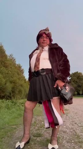 Dressed in a small black skirt and a leopard tie to go do a little something in a parking lot