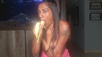 Topless desi squeezes her boobs as she sucks and deepthroats on a banana