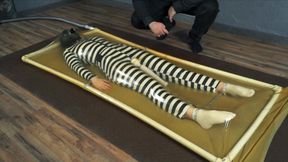 Imprisoned in a vacuum bed with chains and vibration