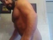 Muscular bodybuilder nude flexing and jerking off
