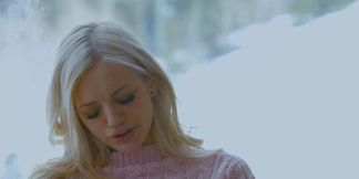 Mia Melano warms up after a cold outdoor play