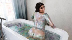 Busty latina takes a glitter bath before fucking