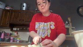 Preparing a large plate of rice with vegetables