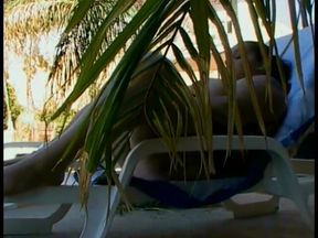 Playful thick newspaper brunette Elizabeth Rollings paddles her pickle sitting in the sun lounger