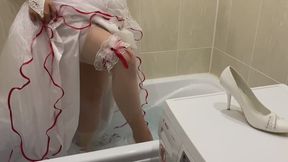 Sexy bride getting wet and ripping stockings