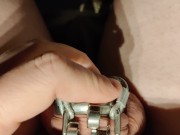 putting on my modified cage so it uses my prince albert piercing