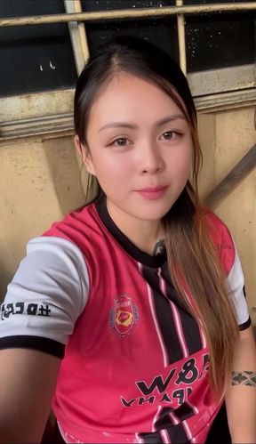 Woman in red and white jersey