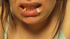 Giantess Girl Unwraps a Candy but Is Surprised Because There Is a Tiny Man in the Candy Bag - She Is Curious to See What It