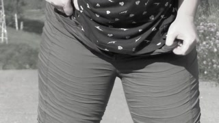 Mature bbw MILF with a big bush on her pussy pisses on the road.