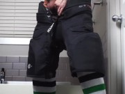 Straight hockey bro strokes his hard cock in his gear after the game