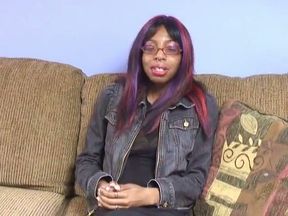 Black Chick with Nipple Rings on Her Big Tits Spreads Her Legs on the Couch
