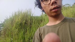 A young man's journey to the rice field where he is urinating again