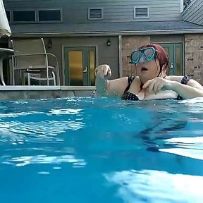 Couple Underwater Diving and Swimming