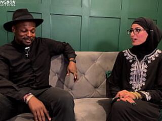 Muslim Aaliyah Yasin is blessed by Father Dimitri's holy water