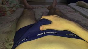 Young guy jerks off uncut cock and moans
