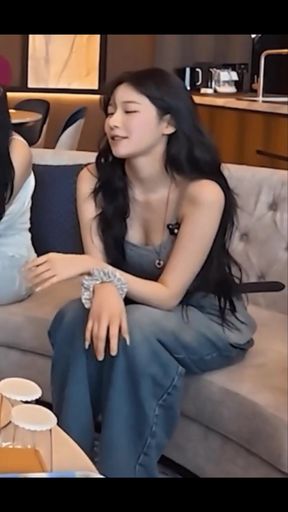 Korean babe with big cleavage shows off her k-pop style tits in a tight outfit