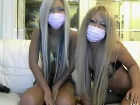 Jap cutie gets buck-wild on cam in steamy girl-on-girl action