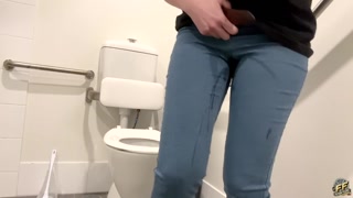 Desperate jeans wetting in a PUBLIC BATHROOM