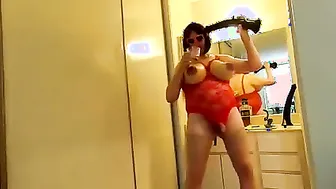Crossdresser with big tits smokes cigar and toys solo
