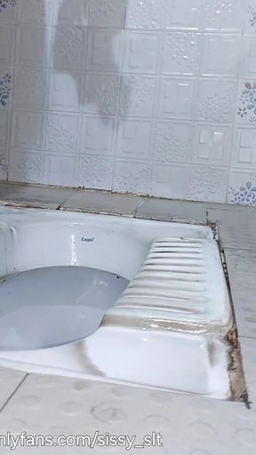 Ladyboy Strip and Piss Outdoor in Chastity Cage and Plug