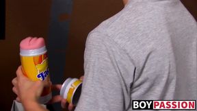 Twink pleases his massive penis with massive flashlight