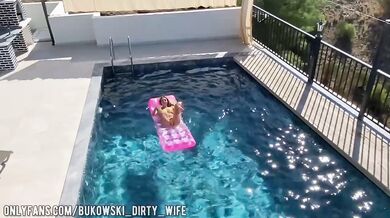 a beautiful blonde masturbates in the pool and lures a peeping guy into a blowjob