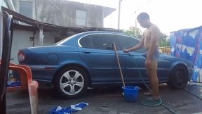 Jesus in gray boxer washing his jaguar car