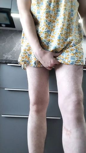 Horny crossdresser in the kitchen.