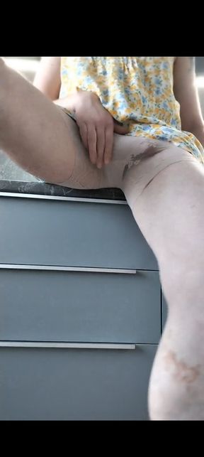 Horny crossdresser in the kitchen.