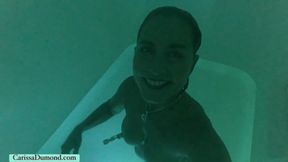 Carissa in the salt float session with nipple suction devices on